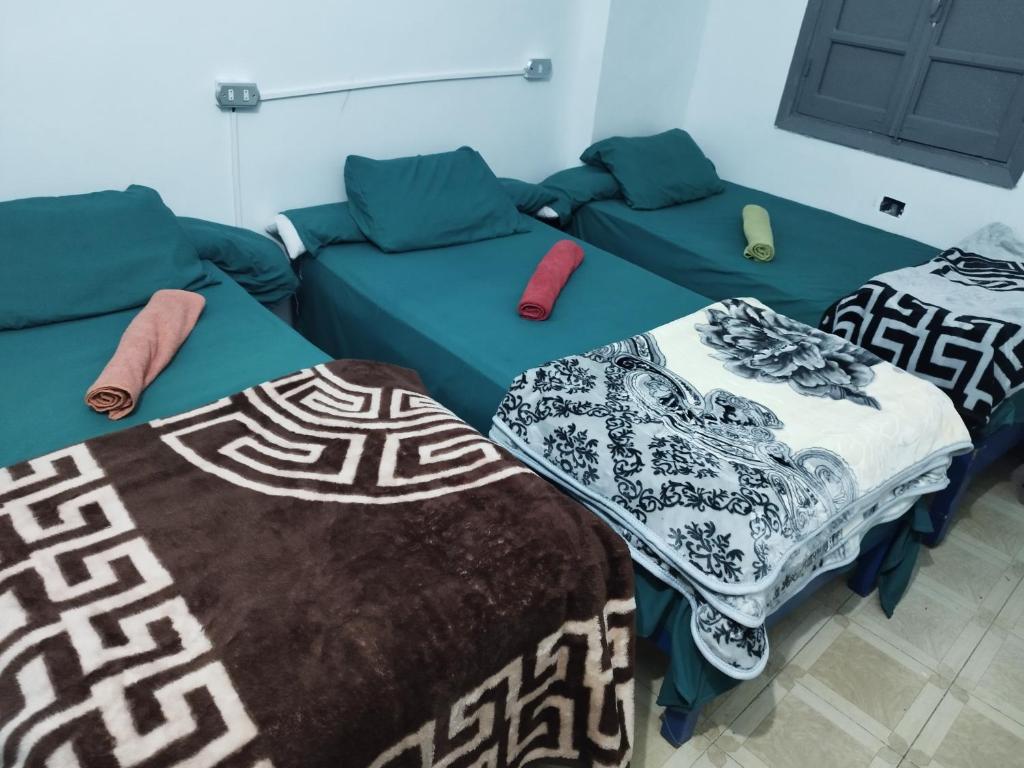 Postel nebo postele na pokoji v ubytování Grand Square Hostel Luxor
