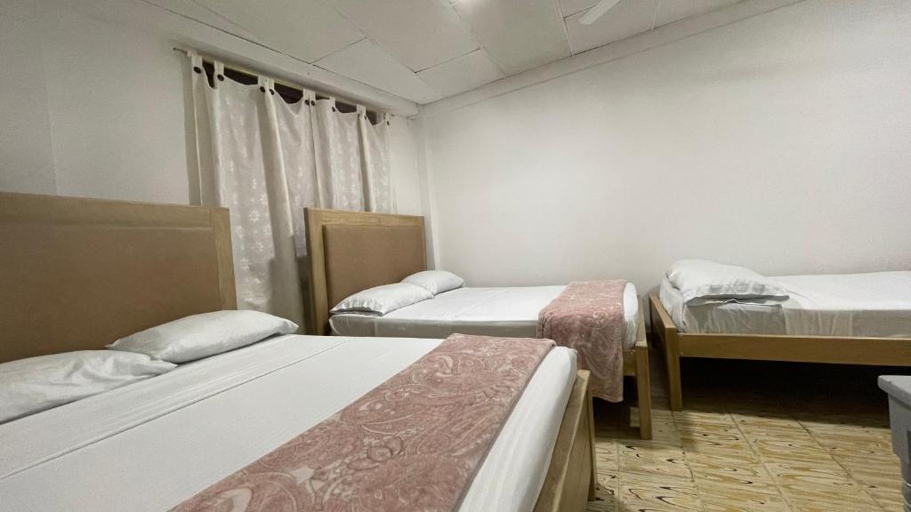 Postel nebo postele na pokoji v ubytování Hotel Balcon de Oro Curumani