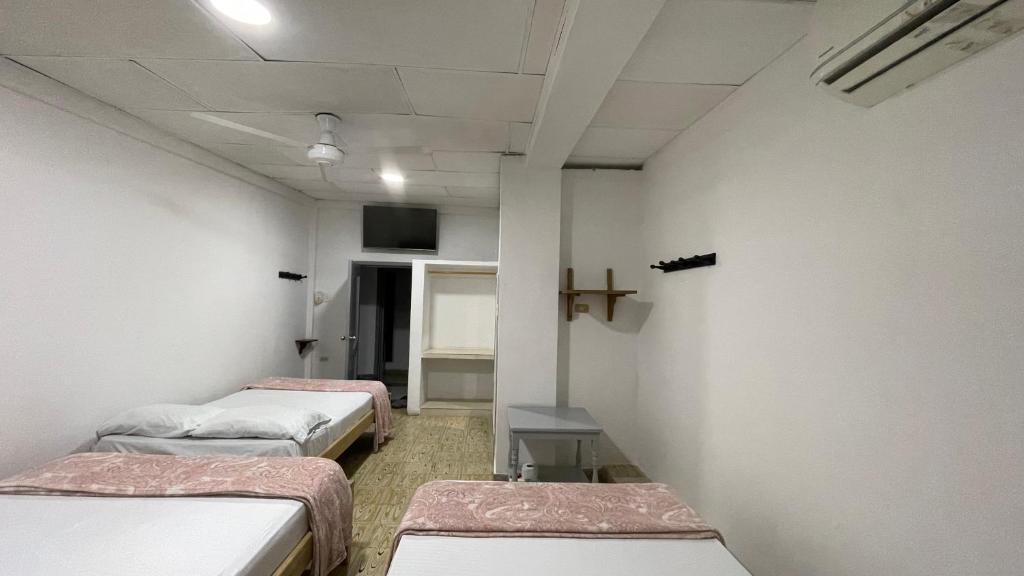 Postel nebo postele na pokoji v ubytování Hotel Balcon de Oro Curumani