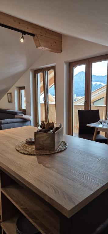 a large wooden table with a box on top of it at Ferienwohnung SEElig in Fischbachau