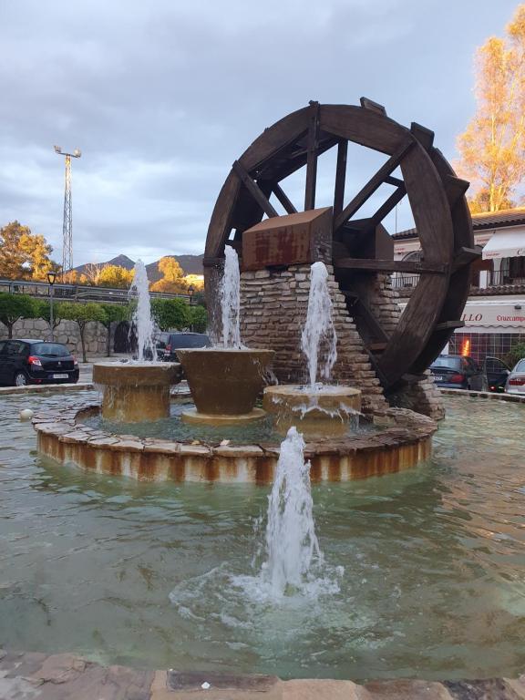 a fountain with water fountains in a park at Apartamento Rural Casa Mar in El Bosque