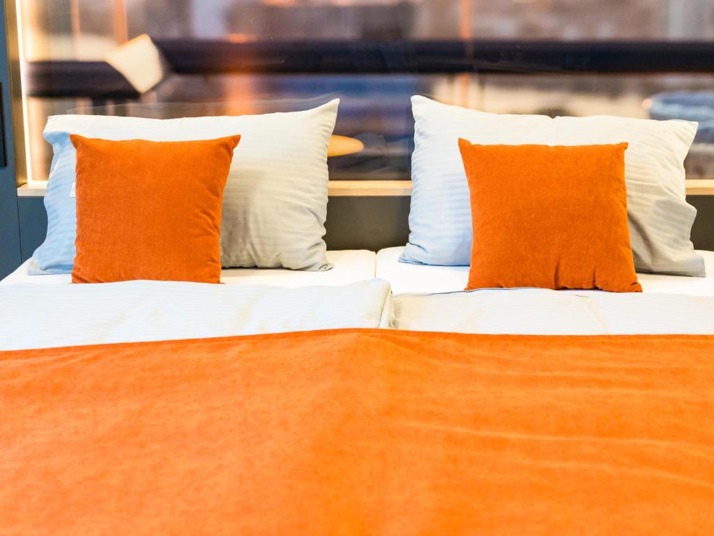 Postel nebo postele na pokoji v ubytování JustStay München Hotel & Apartments