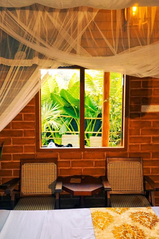 Postel nebo postele na pokoji v ubytování Lunuvila Resort Hiriketiya Dikwella