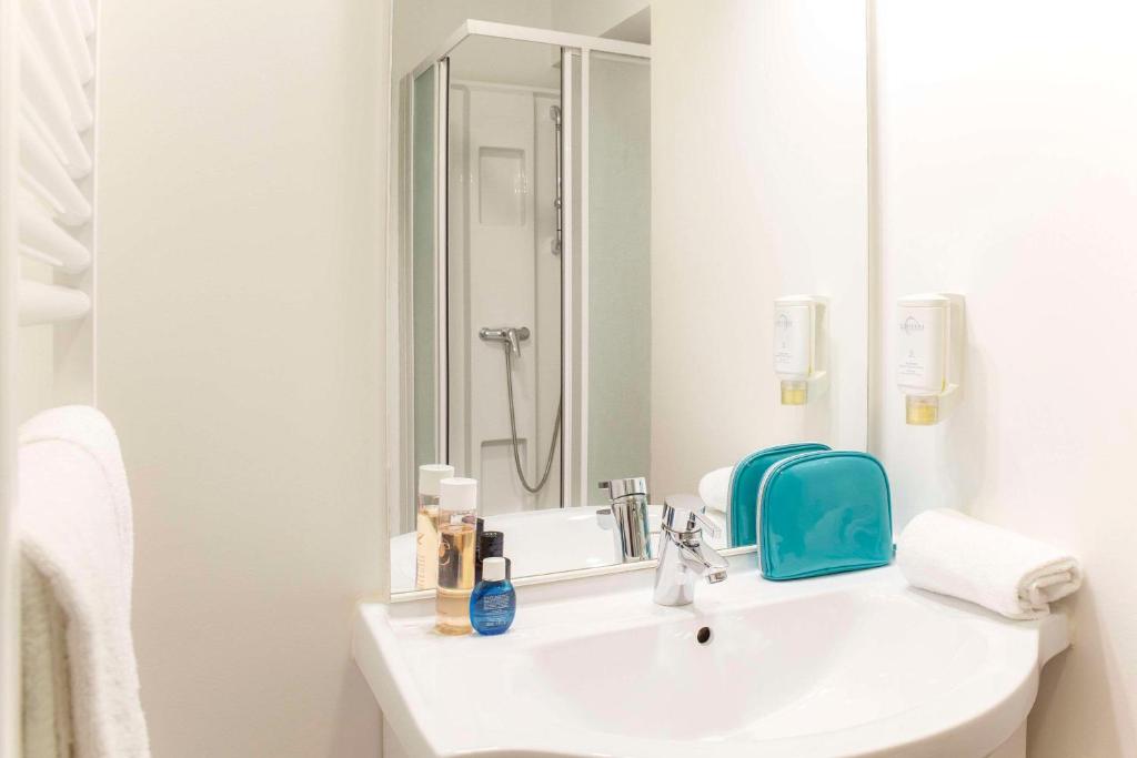 Koupelna v ubytování Comfort Aparthotel Besancon Hauts du Chazal