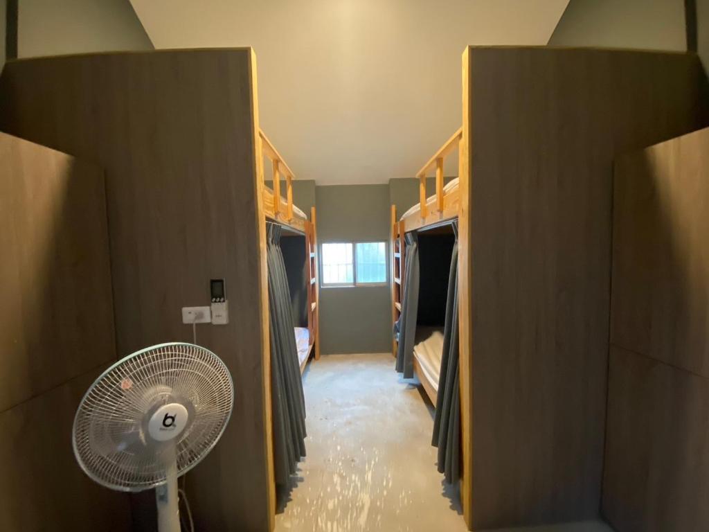 Postel nebo postele na pokoji v ubytování 撒花咖啡民宿 Sakinu & Hanaku Cafe' Hostel