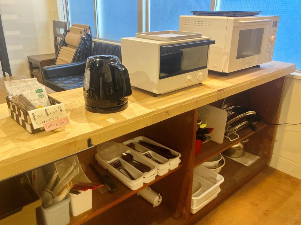 Kuchyň nebo kuchyňský kout v ubytování Kotori Coworking & Hostel Takamatsu