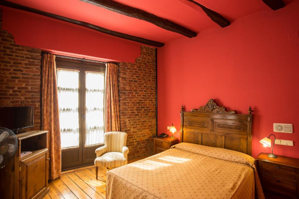 Postel nebo postele na pokoji v ubytování Hotel La Posada Regia