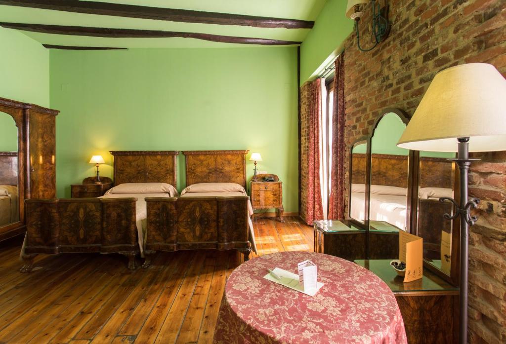 Postel nebo postele na pokoji v ubytování Hotel La Posada Regia