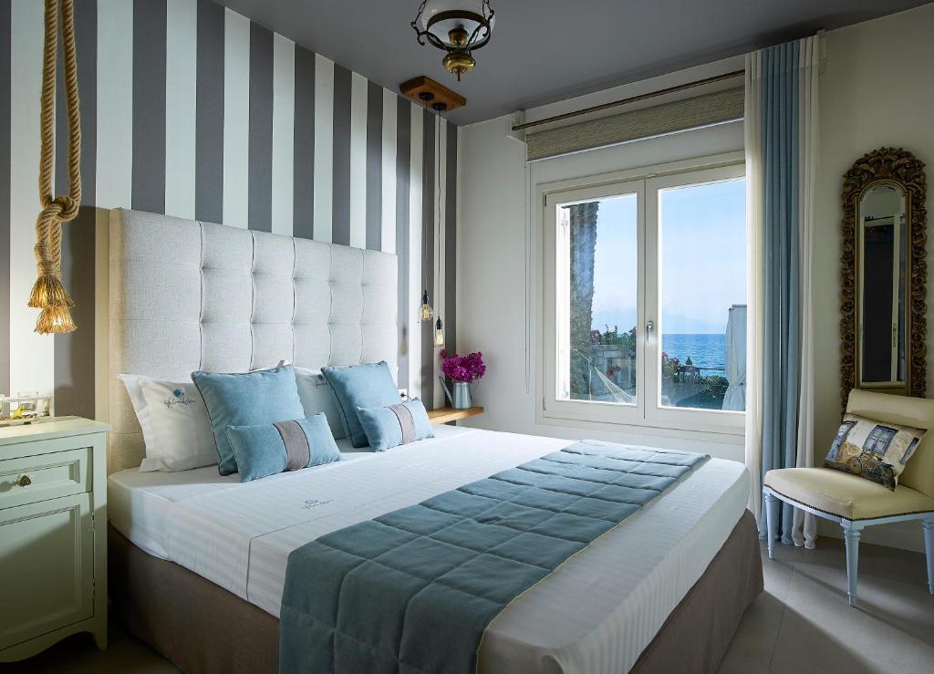 Posteľ alebo postele v izbe v ubytovaní Paradisso Beach Villas