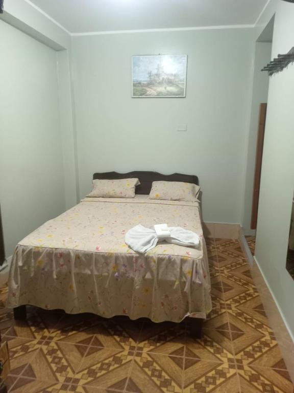 Postel nebo postele na pokoji v ubytování Hostal Leon Internacional
