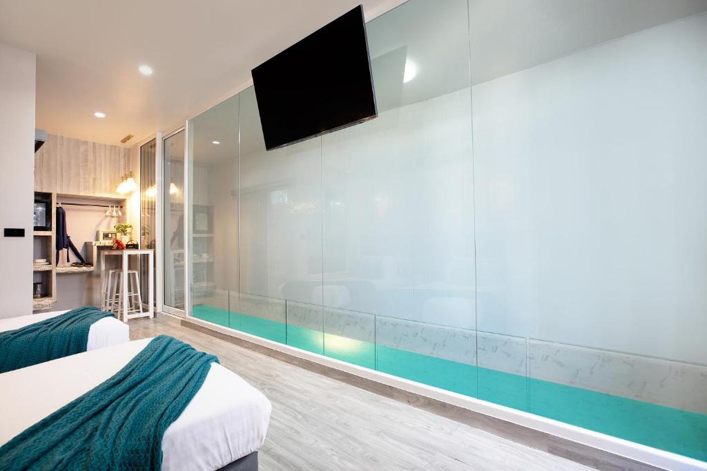 Postel nebo postele na pokoji v ubytování Best Time Pool Suites