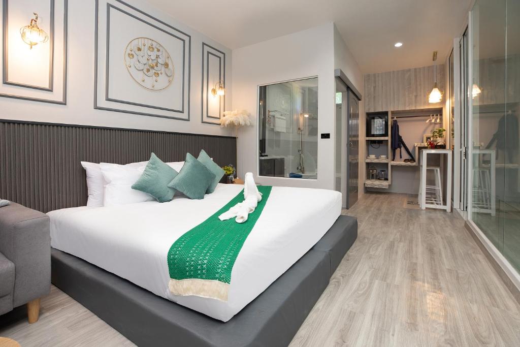 Postel nebo postele na pokoji v ubytování Best Time Pool Suites