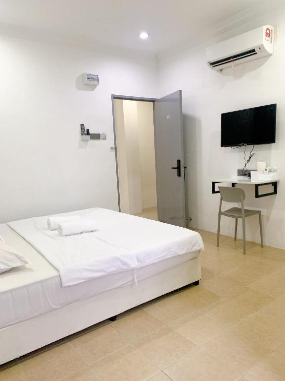 TV a/nebo společenská místnost v ubytování One Stop Hotel Ipoh