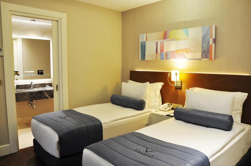 Postel nebo postele na pokoji v ubytování Veyron Hotels & SPA