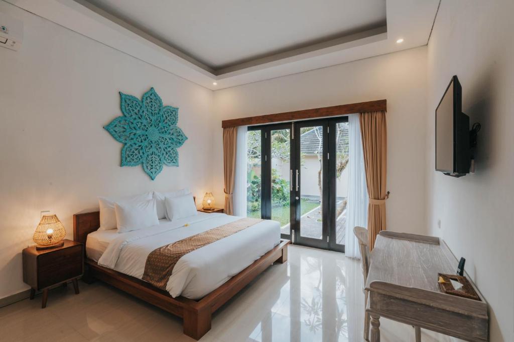 Postel nebo postele na pokoji v ubytování Alam Penari Resort Ubud