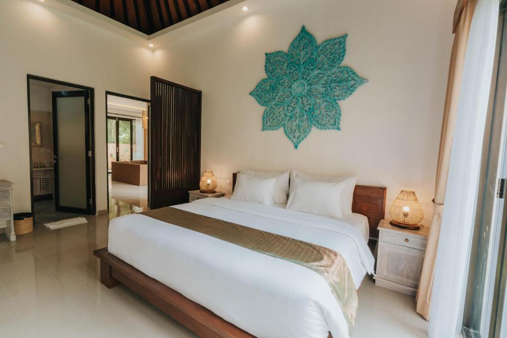 Postel nebo postele na pokoji v ubytování Alam Penari Resort Ubud