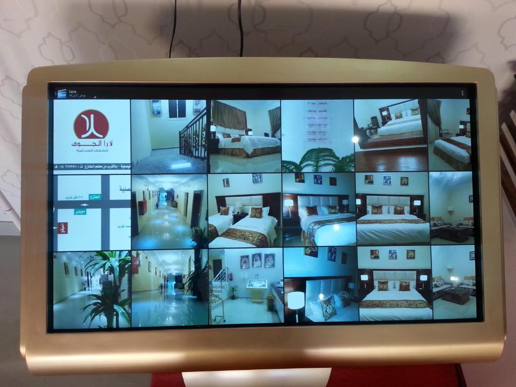 TV a/nebo společenská místnost v ubytování Lara Al Jawf Hotel Apartments