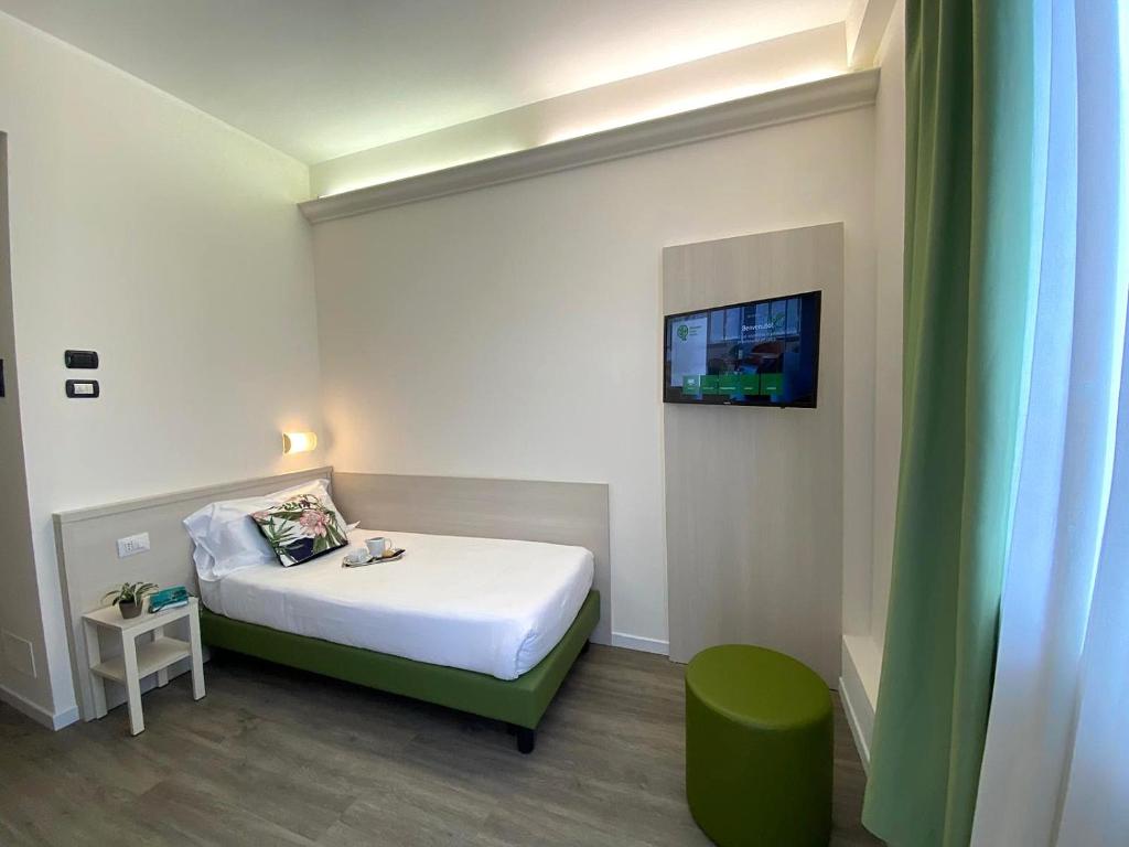 Postel nebo postele na pokoji v ubytování Hotel Embassy