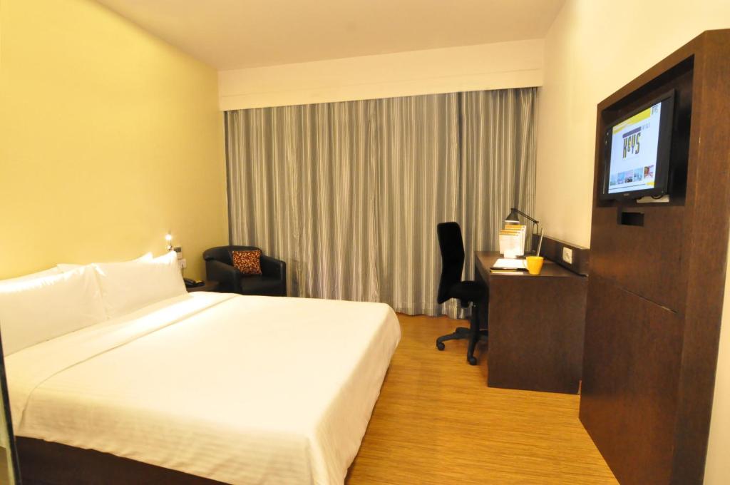 Postel nebo postele na pokoji v ubytování Keys Select by Lemon Tree Hotels, Kochi