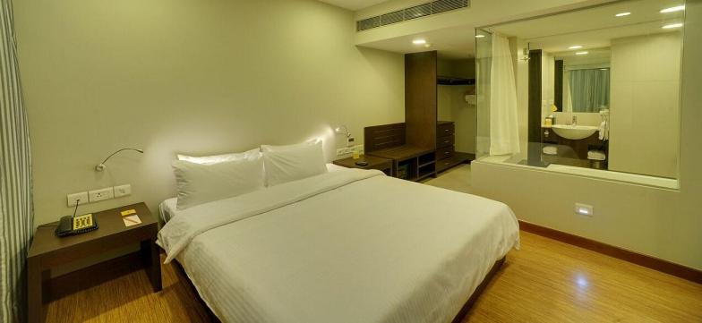 Postel nebo postele na pokoji v ubytování Keys Select by Lemon Tree Hotels, Kochi