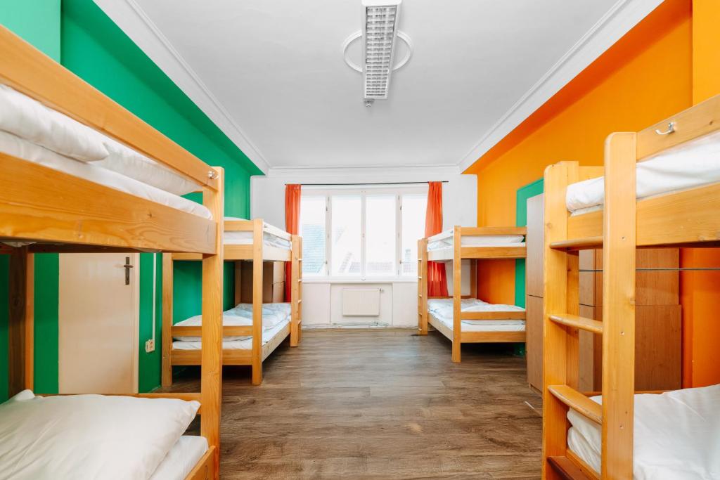 Postel nebo postele na pokoji v ubytování Benedikt City Center Hostel