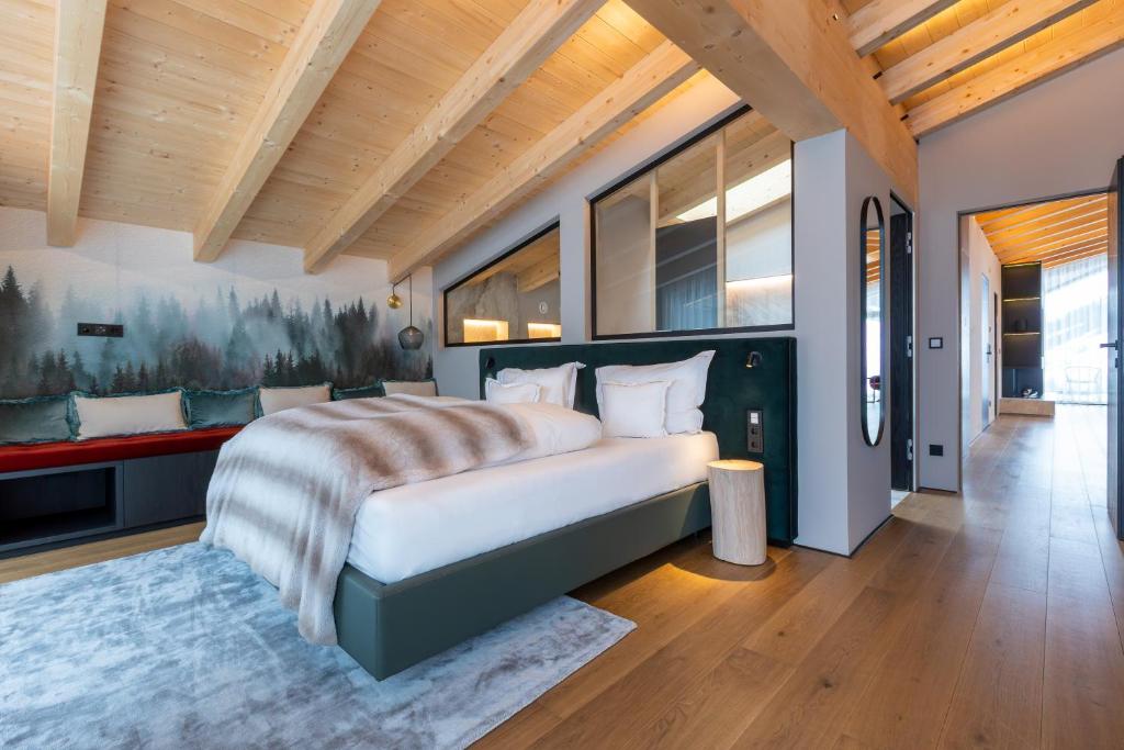 Postel nebo postele na pokoji v ubytování Hotel Madlein