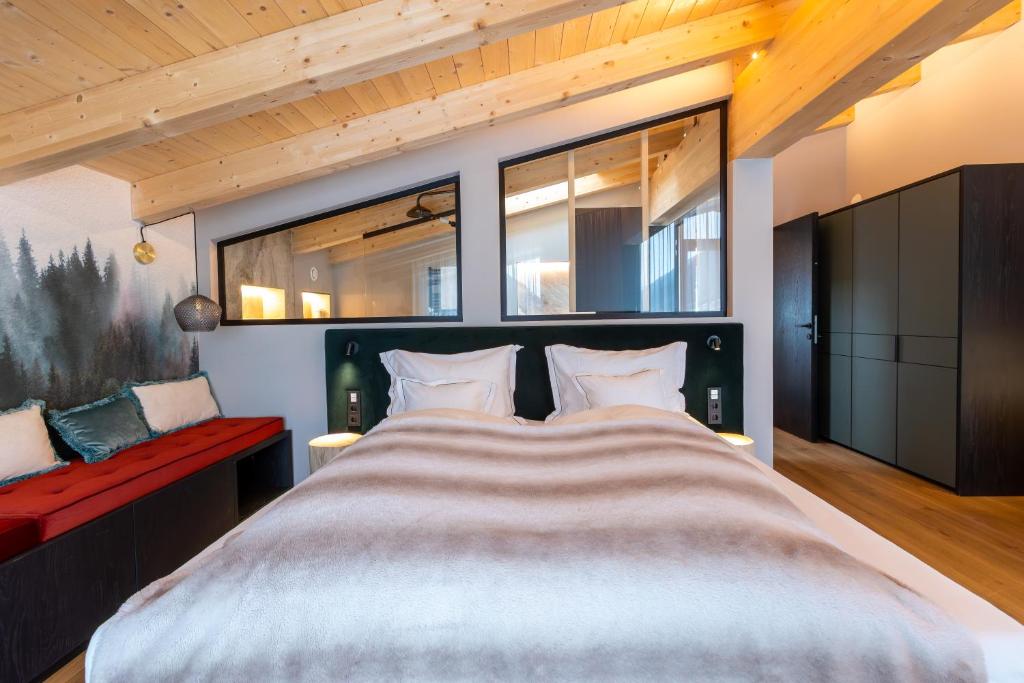 Postel nebo postele na pokoji v ubytování Hotel Madlein