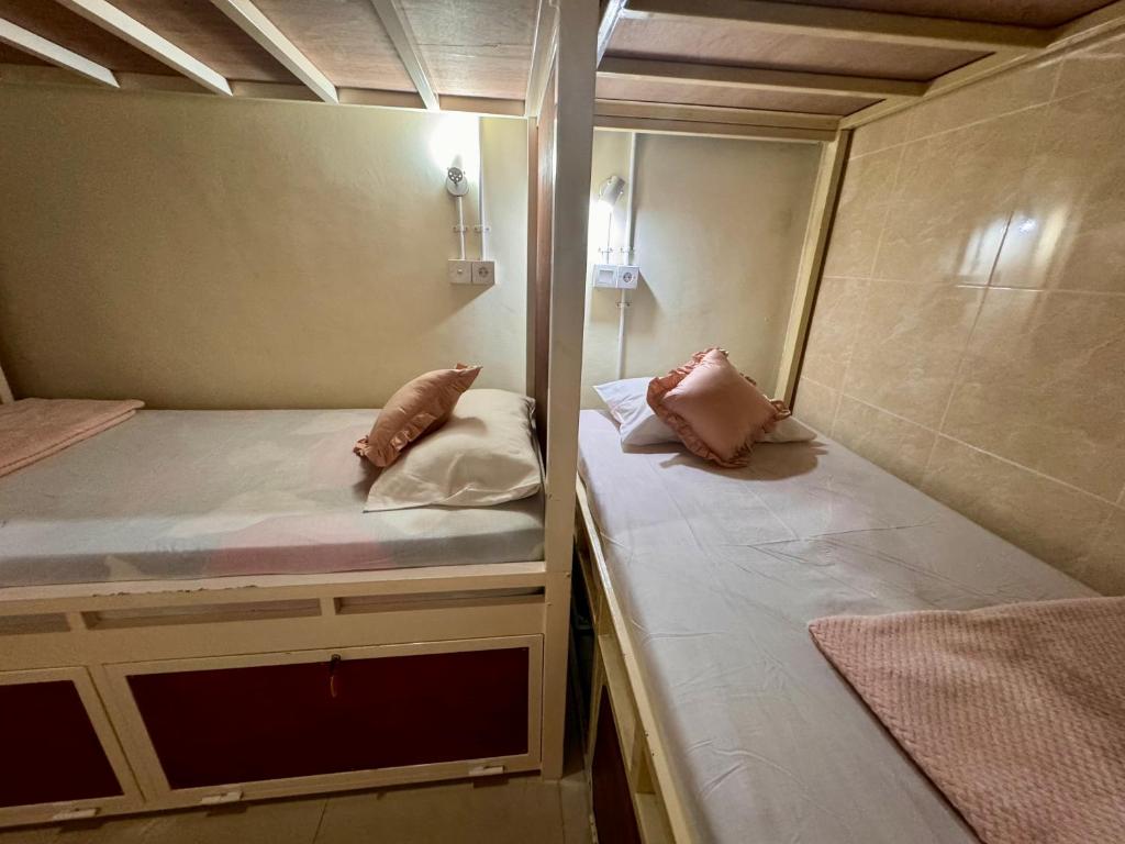 Postel nebo postele na pokoji v ubytování Nua House