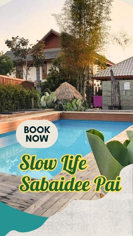 a house with a swimming pool with text book now show life salt cartridge rat at Slow Life Sabaidee Pai in Pai