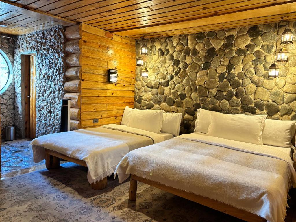 Uma cama ou camas num quarto em The Shire of Sagada