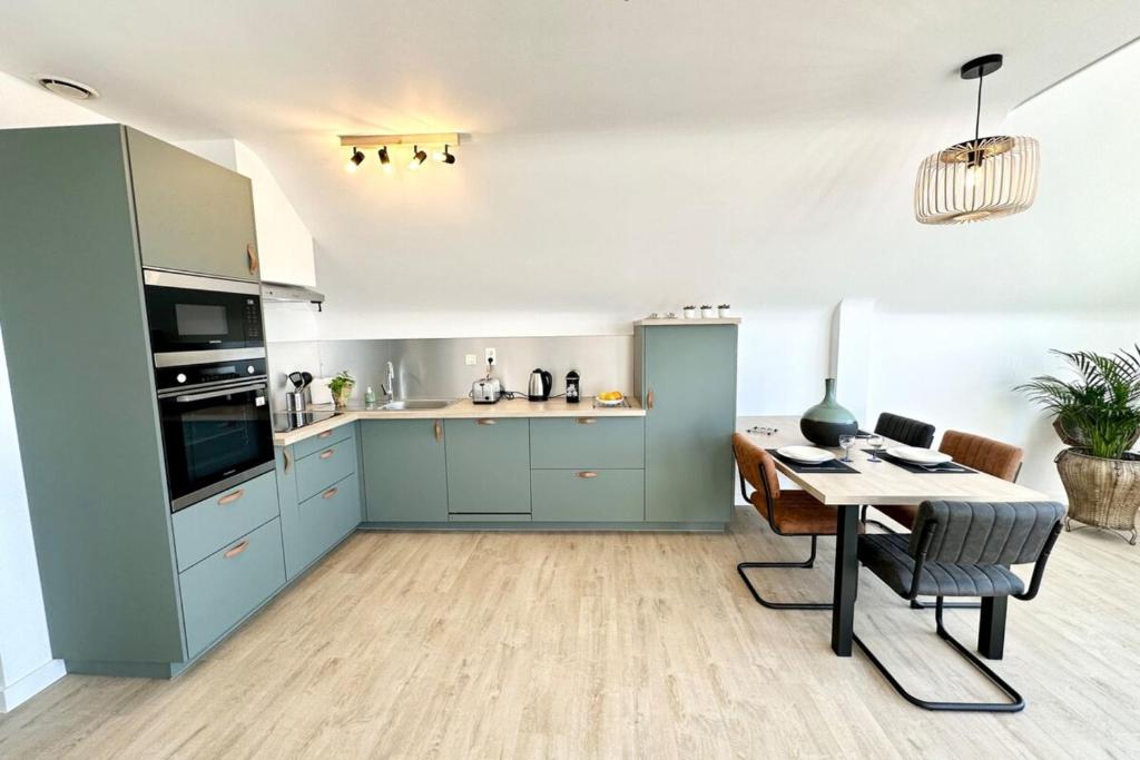 Kuchyňa alebo kuchynka v ubytovaní T2 Neuf Top Cocooning Terrasse - Face à la mer