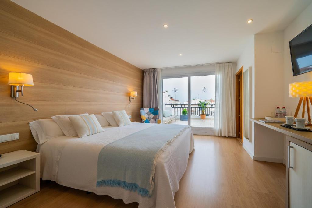 Posteľ alebo postele v izbe v ubytovaní Hostal Menurka