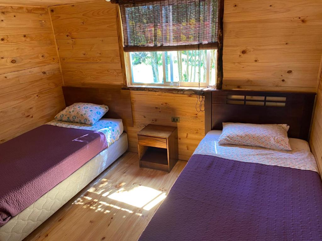 Postel nebo postele na pokoji v ubytování Cabañas Los Fabianes