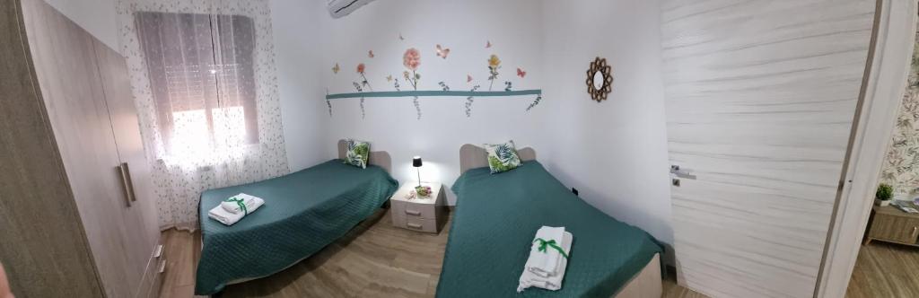 Postel nebo postele na pokoji v ubytování Vida Loca -Appartamento vicino aereporto e 200mt spiaggia