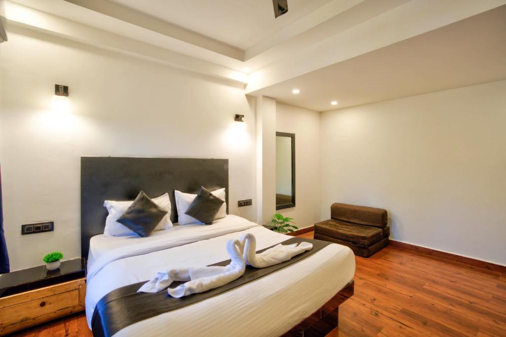 Postel nebo postele na pokoji v ubytování Hotel Vaggi's Place