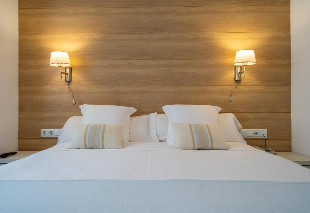 Posteľ alebo postele v izbe v ubytovaní Hostal Menurka