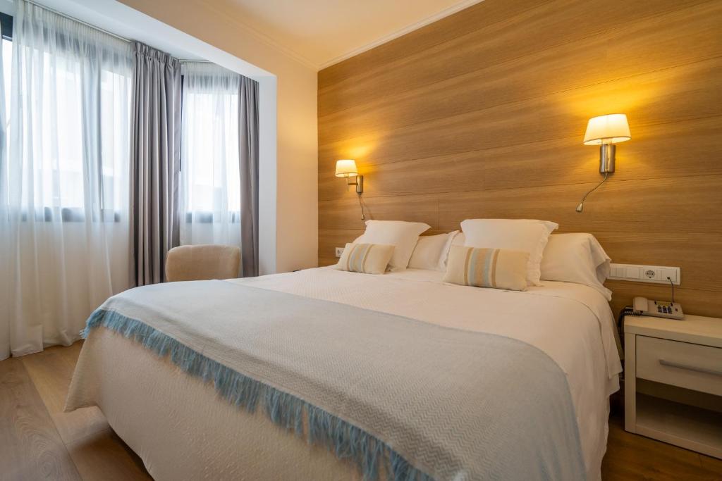 Posteľ alebo postele v izbe v ubytovaní Hostal Menurka