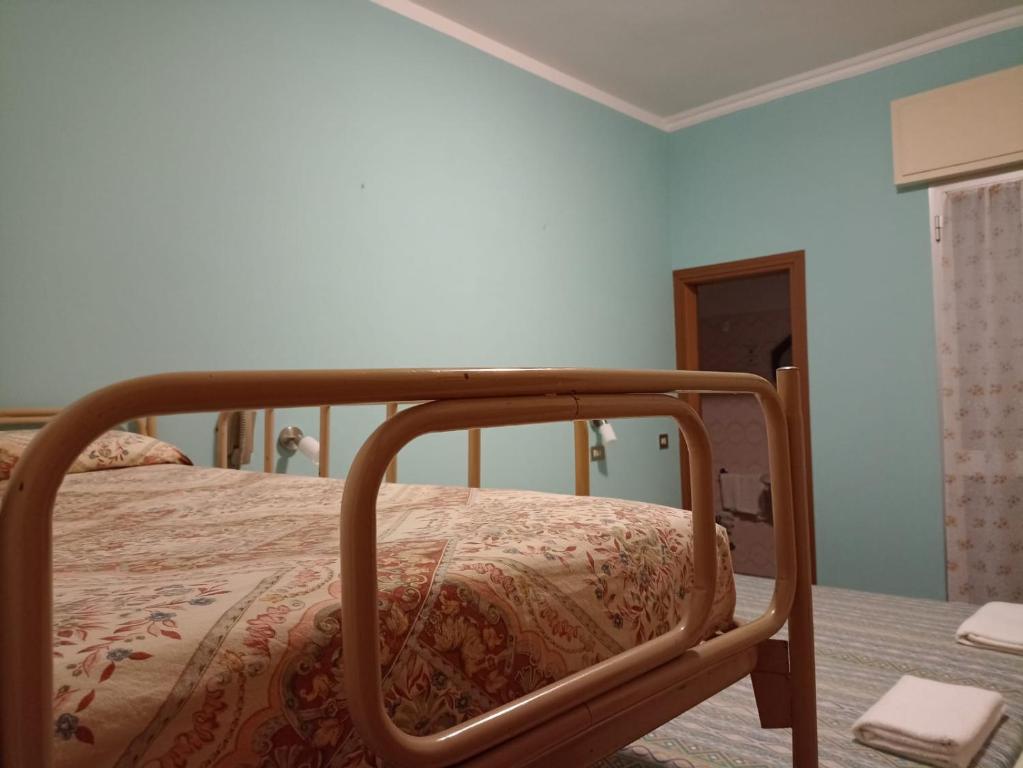 Postel nebo postele na pokoji v ubytování Hotel Toschi