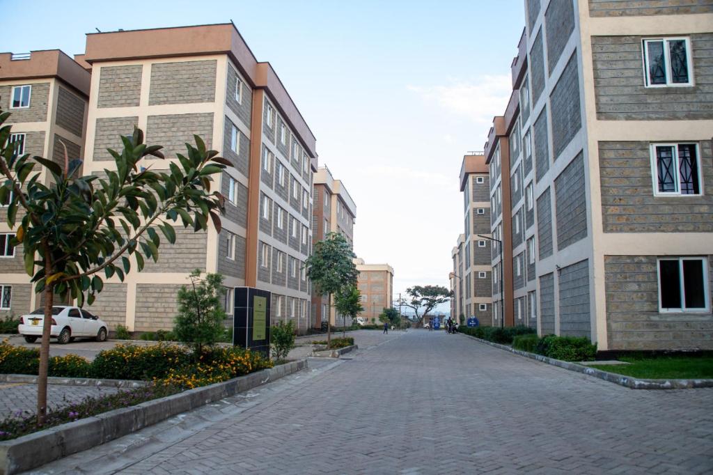 a cobblestone street in a city with buildings at Haven Cozy homes Nax in Nakuru