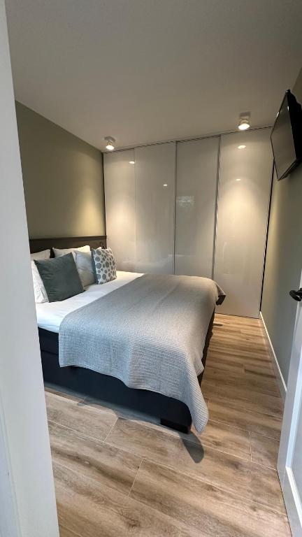 Postel nebo postele na pokoji v ubytování Luxe B&B "In de Schulp", ontspan en geniet van comfort en stijl