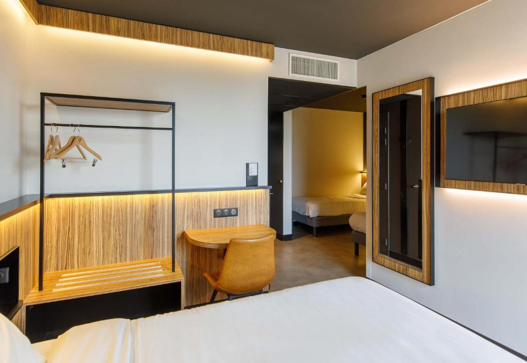 Postel nebo postele na pokoji v ubytování B&B HOTEL Clermont-Ferrand A71-A75 La Méridienne