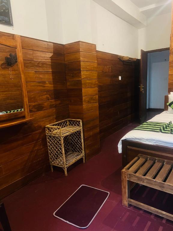 Postel nebo postele na pokoji v ubytování MUM Jungle Inn