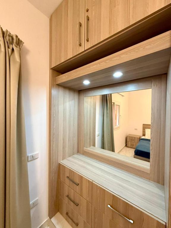 Postel nebo postele na pokoji v ubytování Modern 1BR Apartment - Al Dora Resort, Hurghada