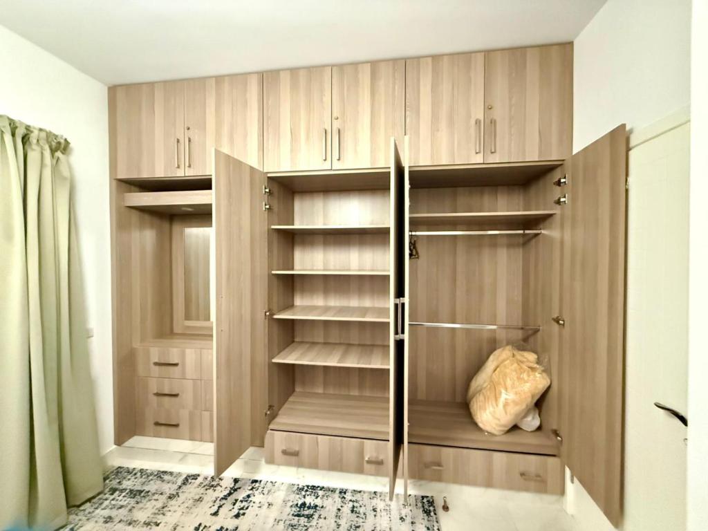 Postel nebo postele na pokoji v ubytování Modern 1BR Apartment - Al Dora Resort, Hurghada