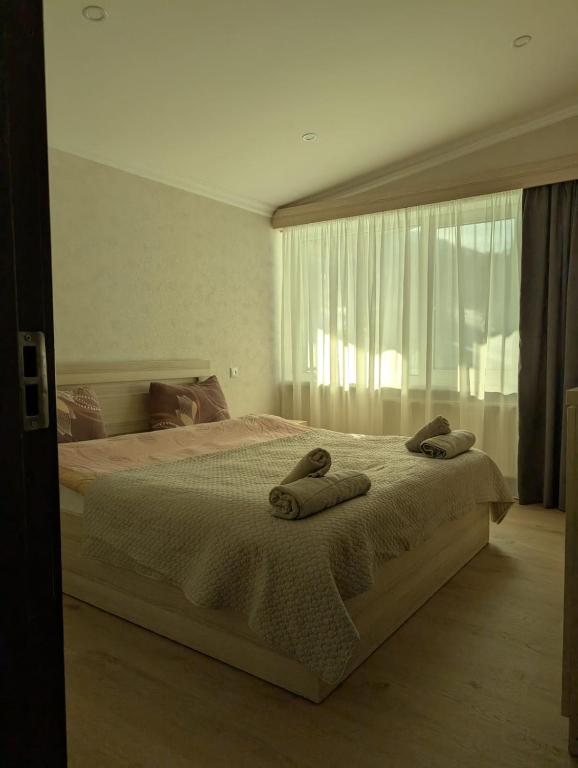 Postel nebo postele na pokoji v ubytování Chalet Kokhta