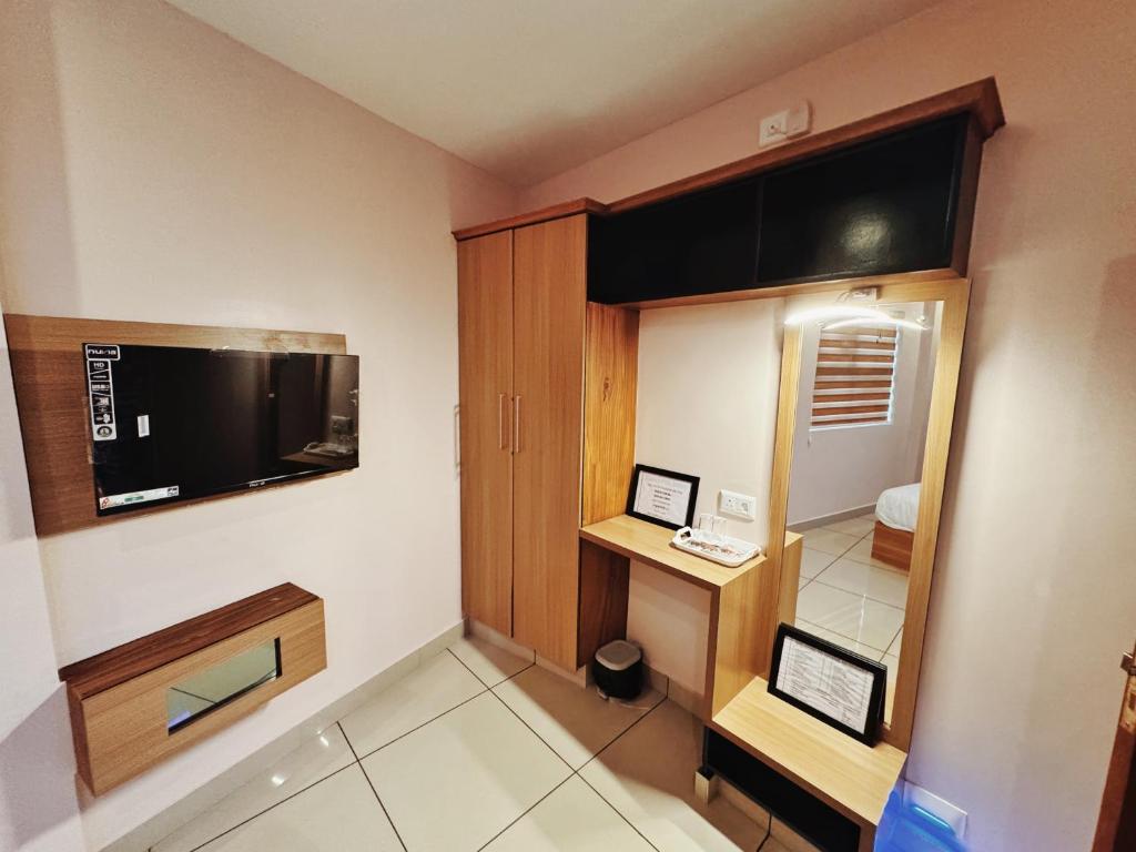 TV a/nebo společenská místnost v ubytování IvyArk Residency