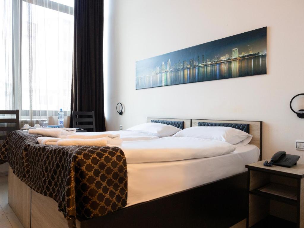 Postel nebo postele na pokoji v ubytování Comfort Hotel