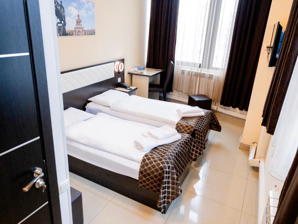 Postel nebo postele na pokoji v ubytování Comfort Hotel