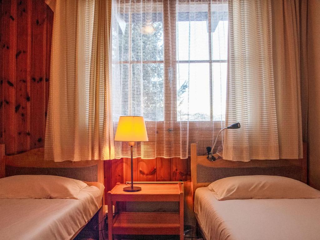 Postel nebo postele na pokoji v ubytování Chalet Magicien by Interhome