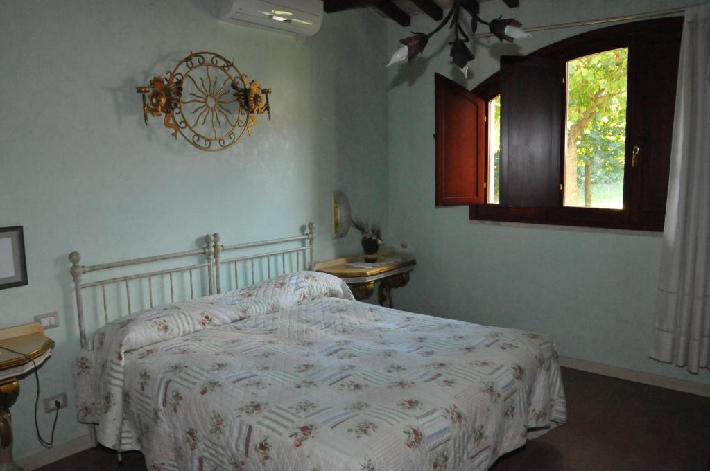 Postel nebo postele na pokoji v ubytování Agriturismo Casa Mattei
